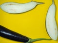 Sliced Ã¢â¬â¹Ã¢â¬â¹eggplant on a yellow background. Vegetables on the table. Beautiful eggplant. Common vegetable